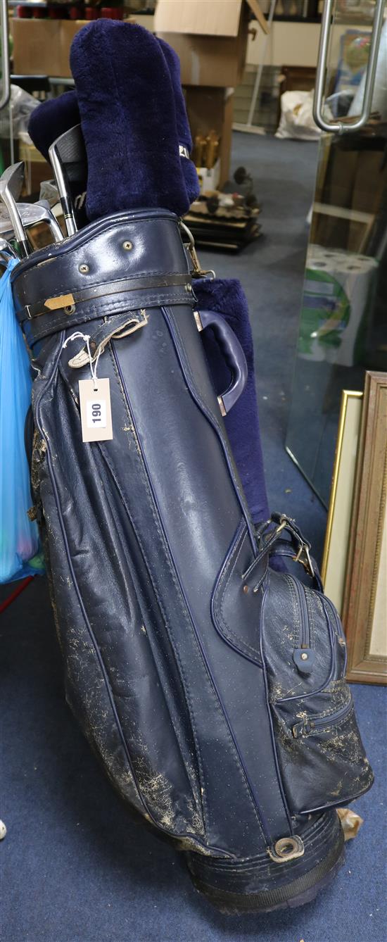 A set of Mizuno Silver Cup golf clubs and a ping putter and golf balls